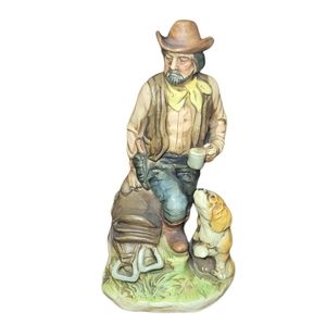 Vintage cowboy,saddle & dog figurine